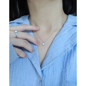 S925 silver jewelry set with heart-shaped opal necklace and ring on a female model