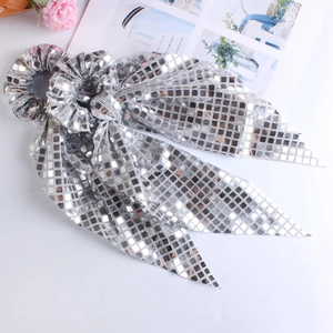 Silver sequin scrunchie with long ribbons featuring disco mirror mosaic texture