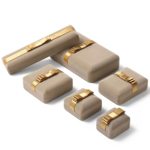 Premium beige velvet jewelry box set with golden ribbon bows for necklaces and rings