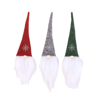 Three Christmas gnomes in red, grey, and green with white snowflake embroidery and long beards