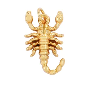 Detailed view of a gold scorpion pendant with dimensions 16mm x 10mm and polished finish