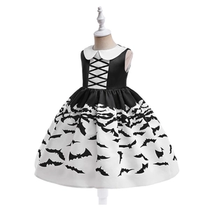 Detail of girls' Halloween dress with white Peter Pan collar and black bat print patterns