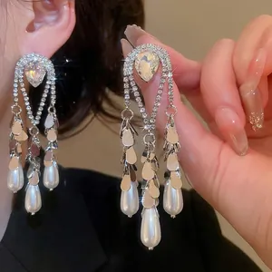 Elegant gold plated silver needle tassel earrings with crystals and teardrop pearls