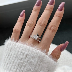Close-up of S925 sterling silver ring with oval cut zircon and crisscross band design