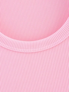 Detail of pink ribbed knit fabric texture and high-quality stitching on the round neckline