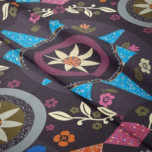 Close-up of bohemian mandala tapestry fabric showing soft texture and detailed floral pattern