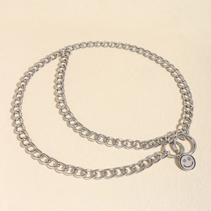 Detail of silver dual-layer metal waist chain with engraved smile pendant and round buckle