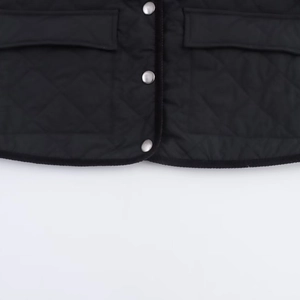 Women's black quilted corduroy jacket with silver metal buttons and a stylish turn-down collar