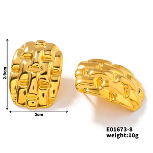 Detail showing gold geometric earrings with woven texture, 2.9cm length and 10g weight