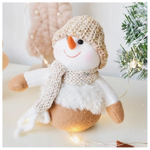 Close-up of a plush Christmas snowman doll with sparkling sequins and knitted textures