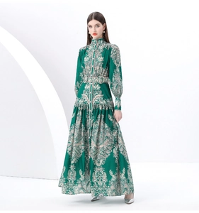 Detail of retro green maxi dress with Baroque floral print and stand collar buttons