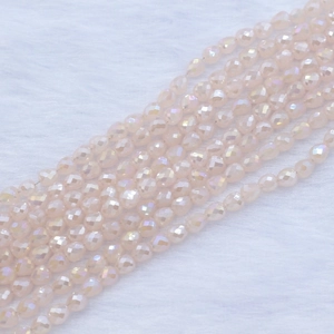 Macro shot of 4x5mm strawberry faceted crystal beads with iridescent shimmer for DIY jewelry