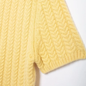 Women's yellow cable knit short sleeve sweater dress featuring soft textured fabric