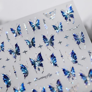 Self-adhesive laser butterfly nail art stickers with golden blue patterns and starry details