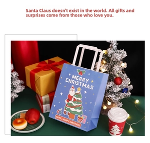 Blue Christmas paper gift bag with Santa Claus and festive holiday decorations