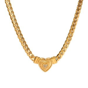 Golden heart pendant necklace with crystal inlay on a thick Cuban chain for women
