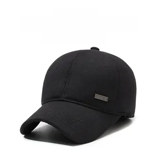 Detail of warm winter baseball cap featuring metal side logo and thick wool blend fabric