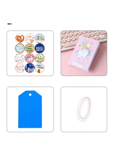 Detail view of cartoon gift set including stickers, unicorn card, tags, and double-sided tape