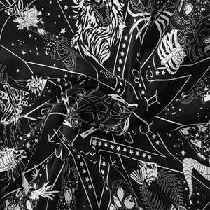 Macro detail of Virgo zodiac tapestry showing black and white celestial gothic print texture