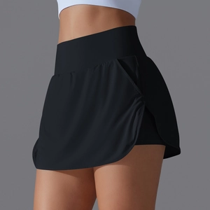 Detail of high-waisted black tennis skirt with inner shorts and side hidden pockets