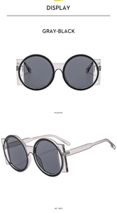 Front and 45-degree angle view of vintage gray-black round oversized sunglasses