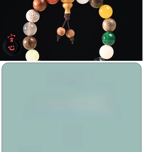 Detailed macro view of Eighteen Seeds Buddhist bracelet with mixed colorful natural beads