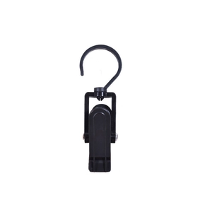 Detail of black plastic rotating hook clip for laundry, closet, and curtain organization