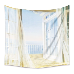 Detail of bohemian tapestry featuring seaside balcony view with sheer white curtains