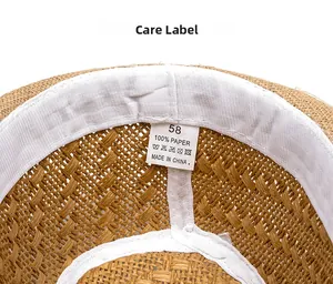 Close-up of straw hat interior with 58cm size label and breathable sweatband detail