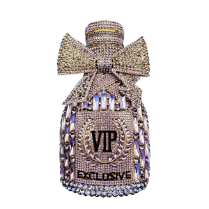 Detail of luxury crystal clutch bag with rhinestone bow and VIP engraving decoration