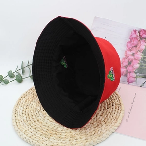 Detail of red and black reversible bucket hat with cactus embroidery on canvas material