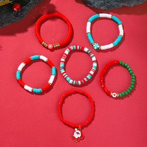 Detailed set of six Christmas beaded bracelets featuring Santa charms and festive colors