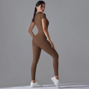 Detail view of the ergonomic waist tailoring and high-stretch fabric on the brown unitard