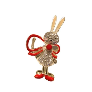 Golden rabbit brooch with sparkling rhinestones and elegant red bowknot details