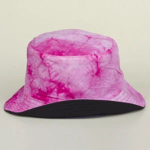 Detail shot of breathable tie-dye cotton fabric with vibrant pink patterns and black brim