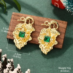 Detailed view of cherry earrings with green zircon stones and dimensions 3.7x2.2cm