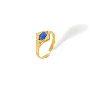 Detailed macro view of vintage gold ring with blue stone and sunburst engraving