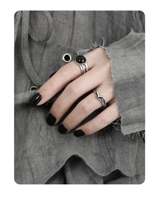 Close-up of S925 sterling silver wide band ring with black agate and wavy stackable ring