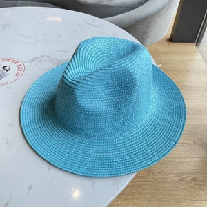 Detailed weave texture of the sky blue wide brim straw fedora hat for summer sun protection