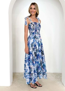 Detailed view of blue floral long dress with smocked bodice and tiered ruffle skirt