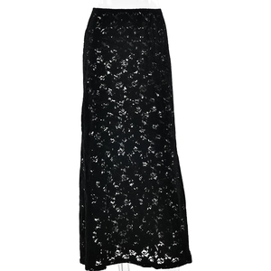 Close-up of the delicate floral lace texture and sheer fabric of this black maxi skirt