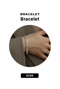 Wrist view of a titanium steel tennis bracelet with baguette-cut zircon crystals
