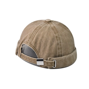 Detail of adjustable metal buckle and washed fabric texture on khaki retro miki hat