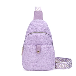 Purple faux shearling crossbody bag with a geometric pattern wide shoulder strap