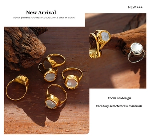 Detailed macro view of gold plated titanium rings with white shell inlay and lava design