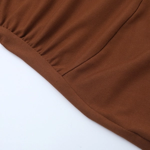 Macro shot of brown knit fabric texture and high-density stitching for strapless jumpsuit