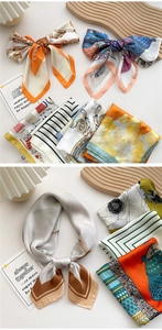 Detailed view of printed silk scarves styled in knots on a wooden wave decorative board