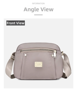 Front view of a dusty purple nylon crossbody bag with silver zippers and metal logo plate
