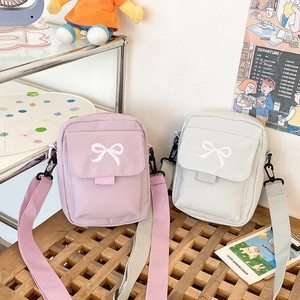 Cute nylon crossbody bags with bow embroidery in pink and blue colors for women