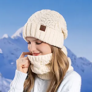 Winter knitted beanie and scarf set in cream white with stylish cable knit for outdoor warmth